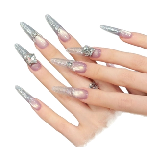 Sparkly purple gradient stiletto press-on nails with silver glitter and chunky rhinestones