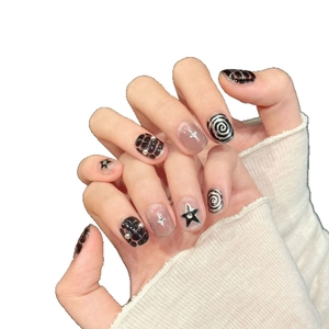 Dark gothic press-on nails set with 3D spiral textures and silver metallic star accents