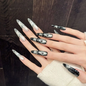 Gothic stiletto press-on nails with black silver cat eye effect and cross pattern
