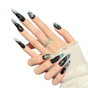 Gothic black and marble stiletto press-on nails with silver crosses and pearls