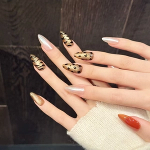 Luxury leopard print and gold cat-eye press-on nails in long stiletto and almond shapes