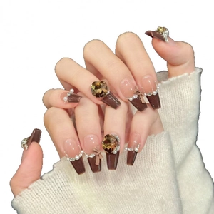 Handmade leopard ice flower press-on nails with amber crystals and 3D bows