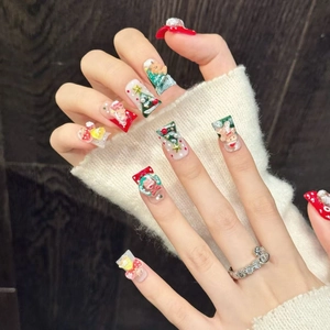 Faux ongles de Noël faits main avec motifs 3D de Père Noël, bonhomme de pain d'épices