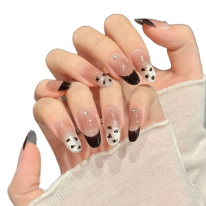 Brown leopard cat eye press-on nails with French tips, hearts, and rhinestone accents