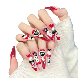 3D poker press-on nails with red heart and black ace motifs on long stiletto tips