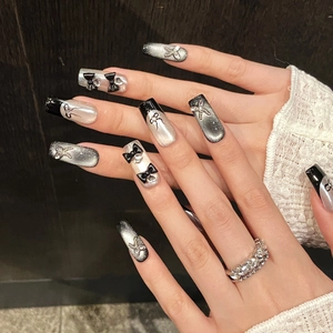 Handmade black cat eye press-on nails with 3D bows and sparkling zircon diamonds