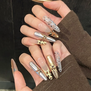 French vintage Y2K animal print press-on nails with metallic stars and leopard patterns