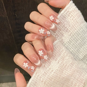 Handmade press-on nails with 3D flowers and cat-eye effect in jelly pink finish