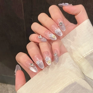 Lavender cat eye press-on nails with 3D floral accents, silver butterflies and pearls