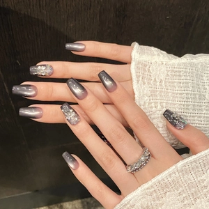 Luxurious long coffin press-on nails with grey-purple gradient cat eye and glitter accents
