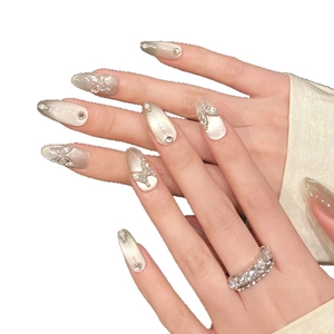Handmade silver cat-eye press-on nails with 3D butterfly rhinestones in long almond shape