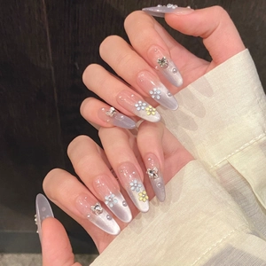 Purple gradient cat-eye almond press-on nails with 3D butterflies and floral details