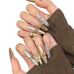 French vintage Y2K leopard print press-on nails with silver stars and metallic finish