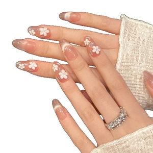 Cat eye press-on nails with 3D white flowers and soft pink gradient in oval shape