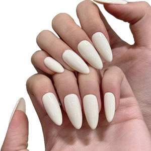 Minimalist creamy white almond-shaped press-on nails with a glossy high-shine finish
