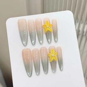 Handmade press-on nails with mint green cat-eye gradient and 3D floral accents