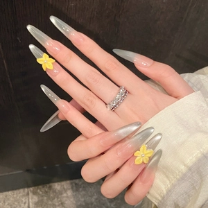 Long stiletto press-on nails with silver cat eye gradient and 3D yellow flowers