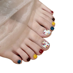 Colorful handmade press-on toe nails with floral 3D patterns and bright glossy finish