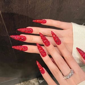 Luxurious red stiletto press-on nails with full crystal rhinestones for high-shine look