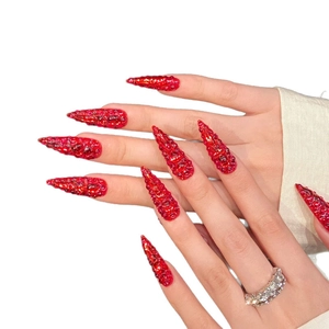 Sparkling stiletto press-on nails with full red crystal rhinestones and luxury glitters