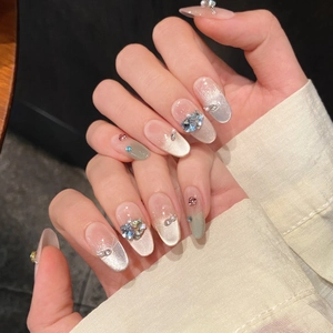 Handmade cat eye press-on nails with luxury aurora shimmer and 3D crystal rhinestones
