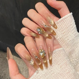 Handmade golden gradient cat eye press-on nails with luxury rhinestones and amber finish