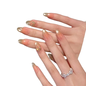 Pink cat-eye press-on nails with 3D butterfly glitter zircon accents in almond shape