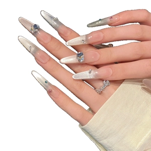 Long cat eye gradient press-on nails with blue pink rhinestones and pearl accents