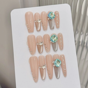 Elegant cat-eye press-on nails set with 3 shapes featuring blue gems and metal butterflies