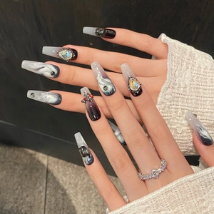 Long trapezoid black and white marble press-on nails with silver glitter and rhinestones
