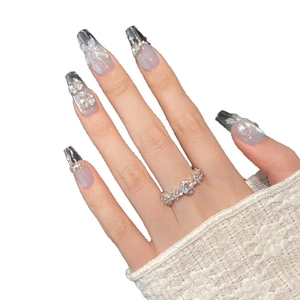 Blue ocean icy butterfly press-on nails with silver glitter and rhinestone bow details