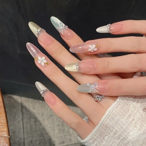 Handmade almond press-on nails with 3D flowers, butterfly charms and cat eye effect