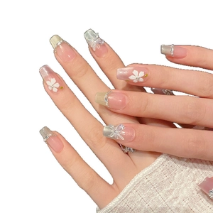 Handmade ballerina press-on nails with 3D white flowers, butterfly charms, and pearls