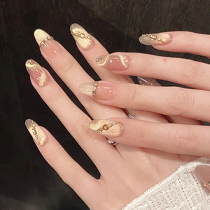 Faux ongles faits main œil de chat champagne doré avec strass et détails luxueux