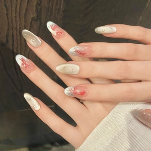 Long almond press-on nails with silver cat-eye effect and red koi fish patterns