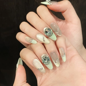 Summer mint green cat-eye press-on nails with luxury rhinestones and silver accents