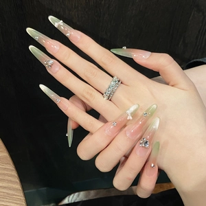 Cat eye green gradient almond fake nails with 3D ribbon bows and crystal heart accents