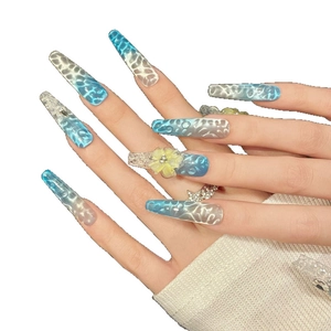 Blue gradient cat eye press-on nails with 3D water ripples and floral accents