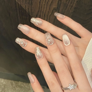 Cat-eye press-on nails with silver glitter accents and star-shaped rhinestone ring