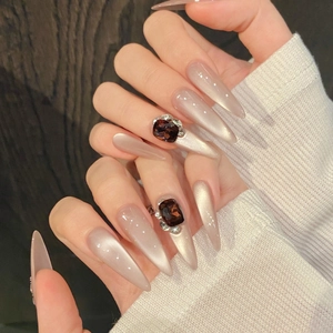 Handmade long stiletto cat-eye press-on nails with amber gemstones and crystals