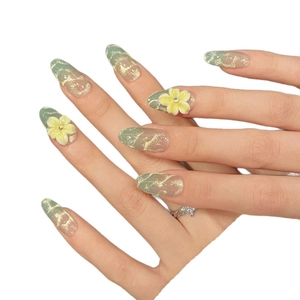 Handmade almond press-on nails with sea salt green marble pattern and 3D floral accents
