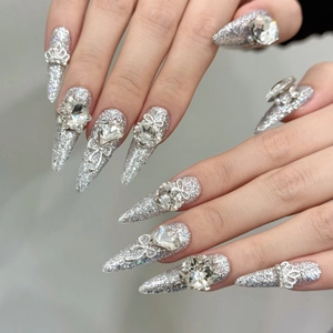 Luxury silver glitter press-on nails with 3D metal bows and crystal rhinestone accents