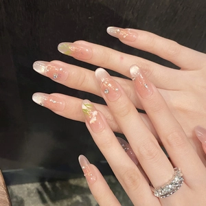 Pink gradient almond press-on nails with cat eye effect, floral art and pearl accents