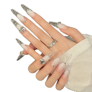 Extra long pointed press-on nails with pink gradient and luxury rhinestone 3D embellishments