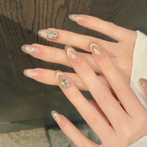 Cat eye press-on nails with glitter pink gradient and sparkling 3D rhinestones