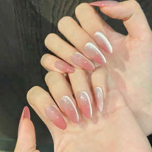 Pink cat eye gradient press-on nails in long almond shape with glossy handmade finish
