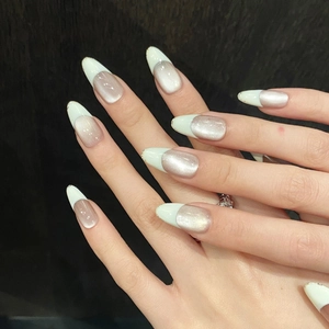 Almond-shaped silver cat-eye press-on nails with mint green French tips and gold glitter