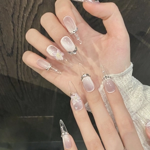 Handcrafted long almond press-on nails with 3D flower art and purple cat eye effect