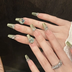 Sparkling mint green cat eye press-on nails with luxury rhinestones and pearl accents