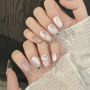 3D floral press-on nails with silver cat eye effect and rhinestone accents for luxury manicures